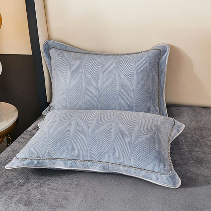 Plush milk velvet bed sheet set, botanical print, enhancing bedroom decor.
