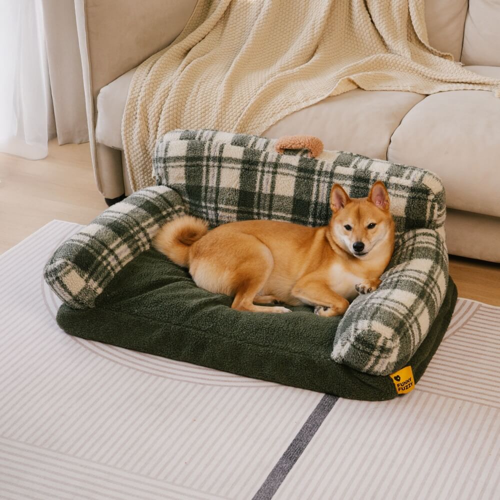 Small dog or cat relaxing in a soft, washable, calming pet bed, plush material