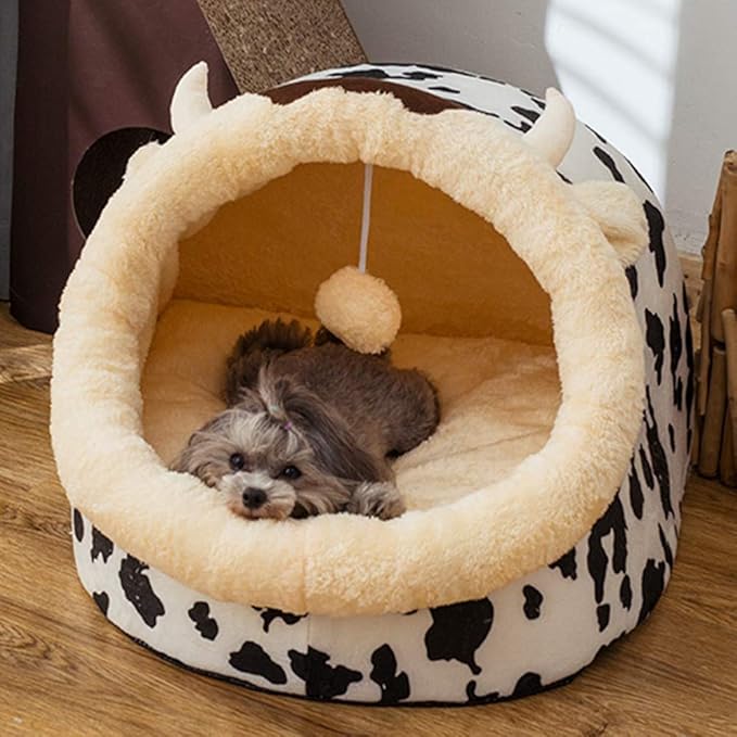 Warm and inviting cat bed, black & white cow print for playful comfort and decor