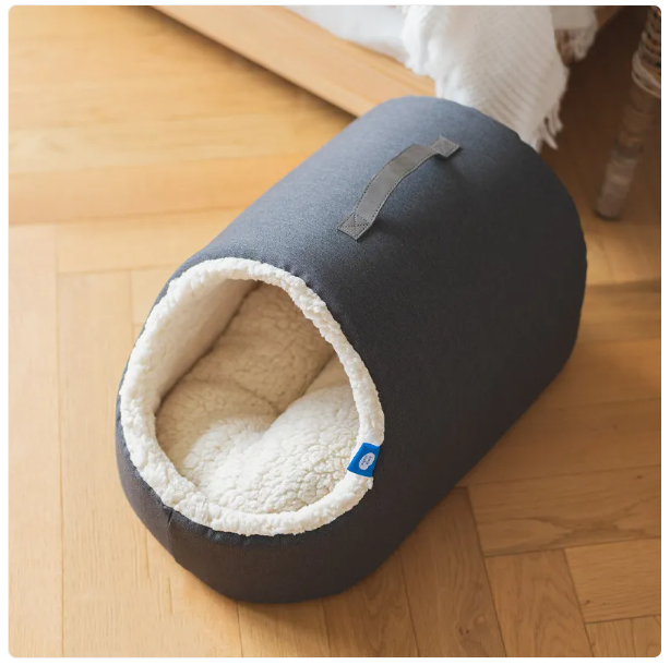 Luxury pet house cat bed with a cozy design and a plush, fluffy rim for ultimate relaxation