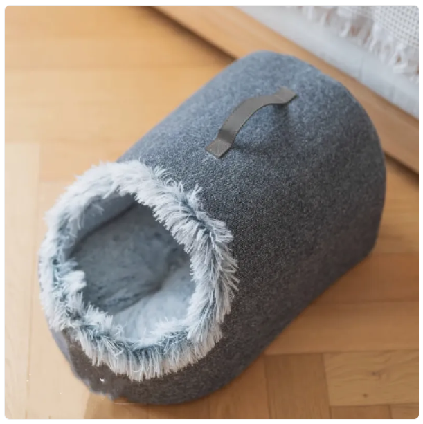 Enclosed cat bed, a comfortable pet furniture piece with a soft fluffy edge for deep sleep