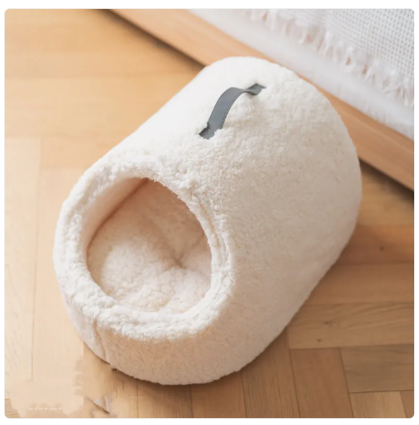 Dark grey cat bed, a cozy pet house with a fluffy edge, providing a private cat sanctuary