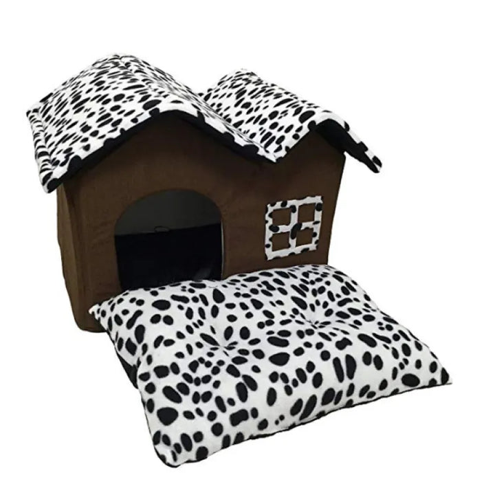House-shaped pet bed with a window, offering a warm and inviting cozy cat hideaway.