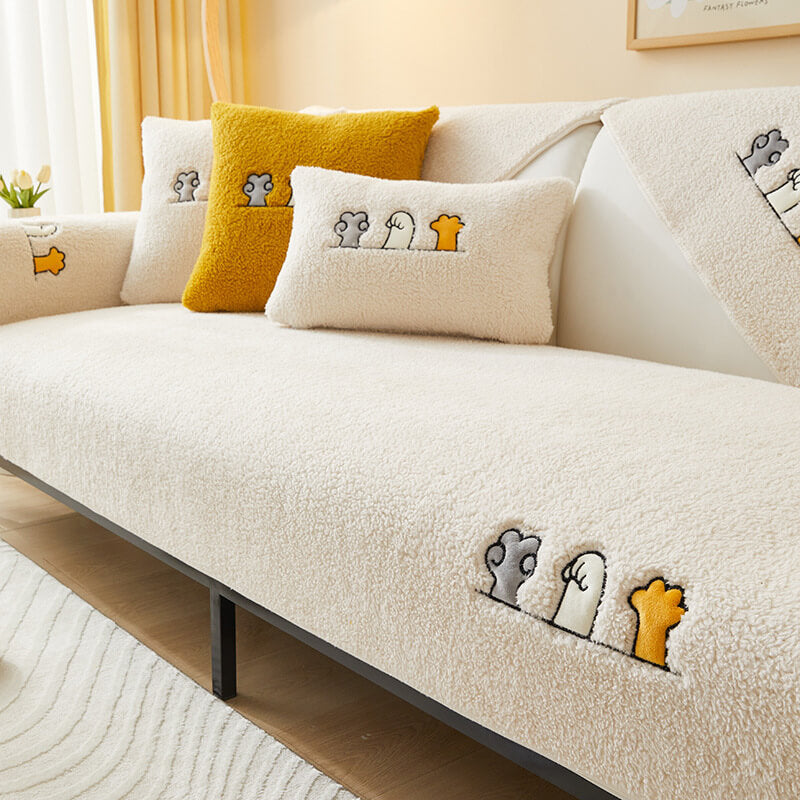 Cozy cat paw sherpa fleece anti-slip sofa protector for a pet-friendly sectional couch