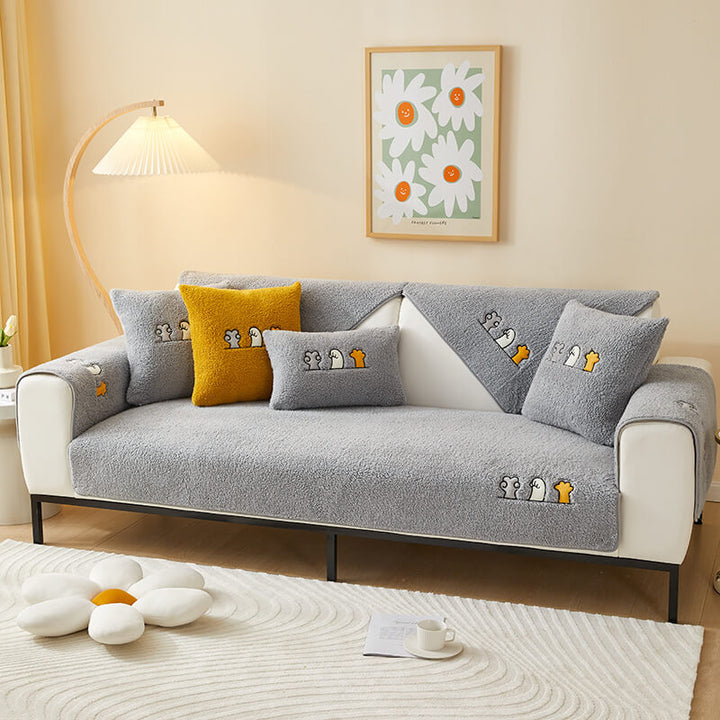 Durable sherpa fleece sofa protector featuring a charming cat paw anti-slip base