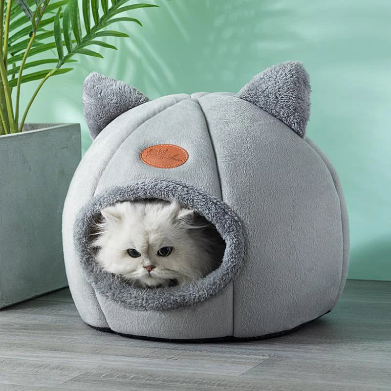 Pet bed cave providing cozy anxiety relief, featuring a tent design for cats and small dogs.