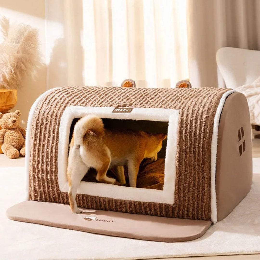 Soft, washable dog bed designed as an enclosed pet house, ideal for small and medium-sized pets' winter comfort.