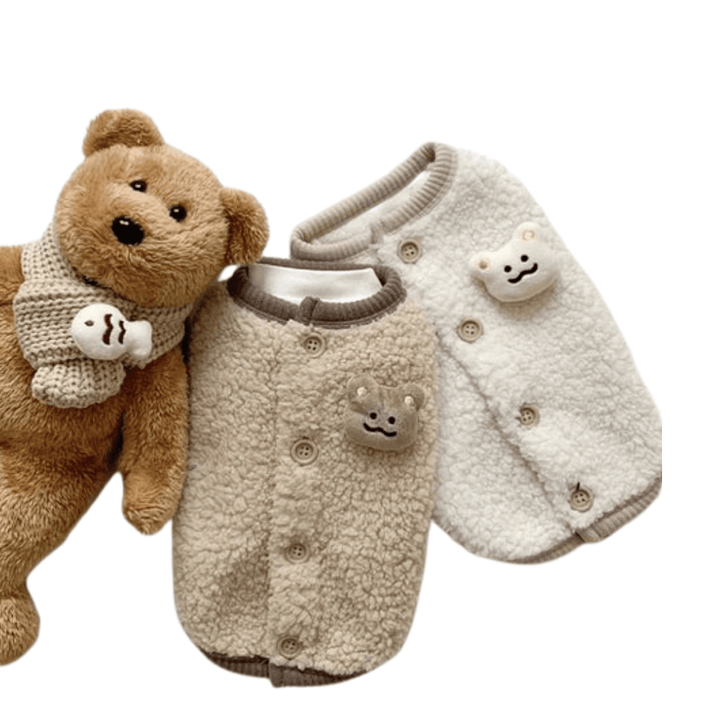 Warm pet apparel: faux fur dog vest in cream shown on a small dog, perfect for cold weather