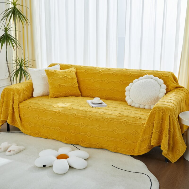 Plush faux fur sofa cover in a neutral tone, providing comfortable seating and stylish furniture protection.