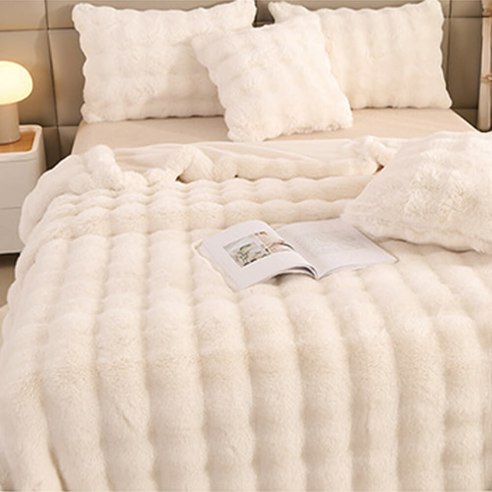 Soft faux rabbit fur blanket and pillowcase, providing a warm and inviting atmosphere