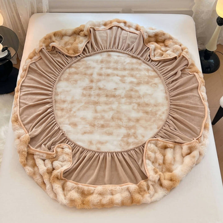 Cream-colored cozy faux rabbit fur fitted sheet and pillowcases, enhancing bedroom decor.