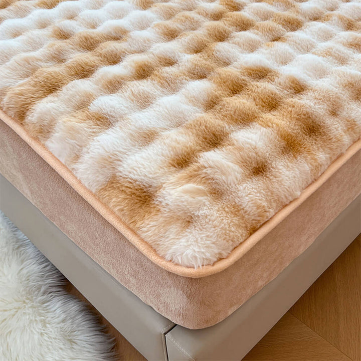 Plush faux rabbit fur fitted sheet with elastic corners, ensuring a snug fit on mattress.