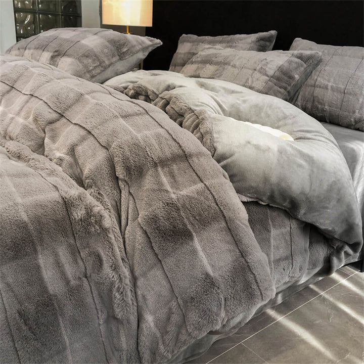 Bedroom display of a grey faux rabbit fur milk velvet sheet set, warm and inviting