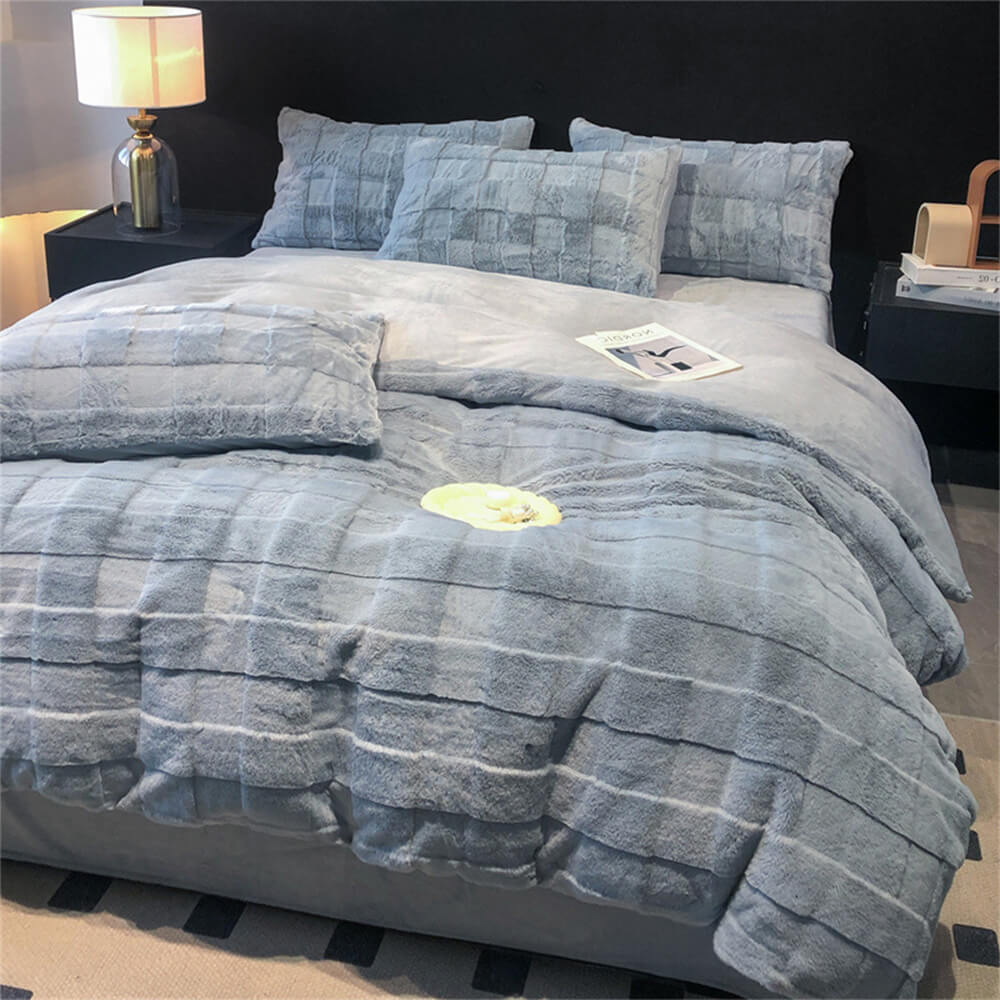 Comfortable blue faux rabbit fur velvet sheet set, perfect for a cozy, luxury bedroom