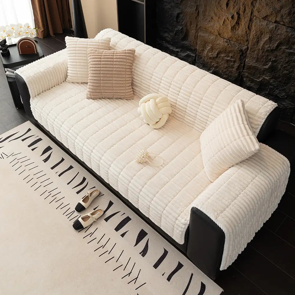 Elegant flannel sofa cover in a cozy living space, safeguarding furniture from pets.