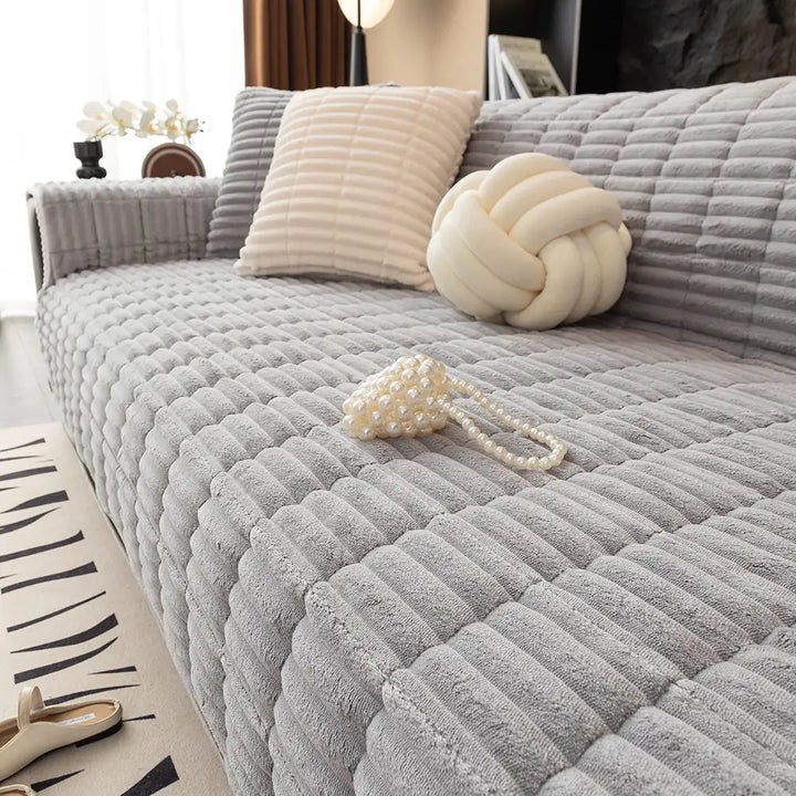 Practical home decor: flannel sofa cover providing robust furniture protection.