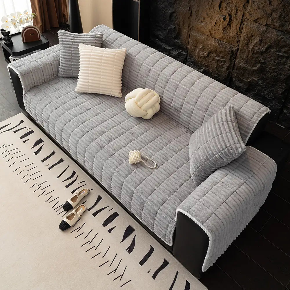 Pet-proof flannel couch protector, blending seamlessly with modern home decor.