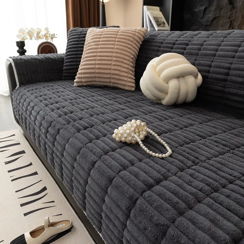 Secure flannel sofa slipcover, preventing spills and pet hair from reaching upholstery.