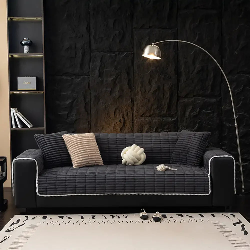 Easy-to-install flannel sofa cover, offering instant protection for pet owners.