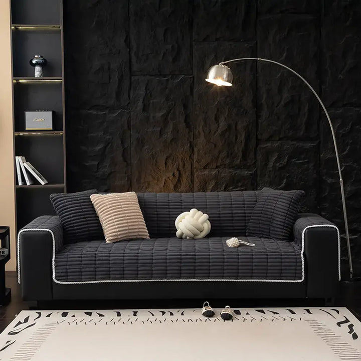 Easy-to-install flannel sofa cover, offering instant protection for pet owners.