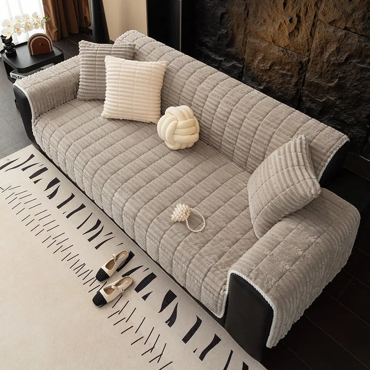 Pet-friendly home decor: machine washable flannel sofa cover in a modern living room setting.