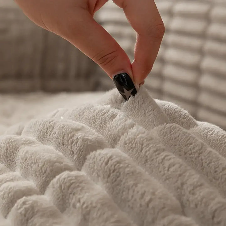 Durable flannel couch cover protecting a sofa, featuring a non-slip design for active pets.
