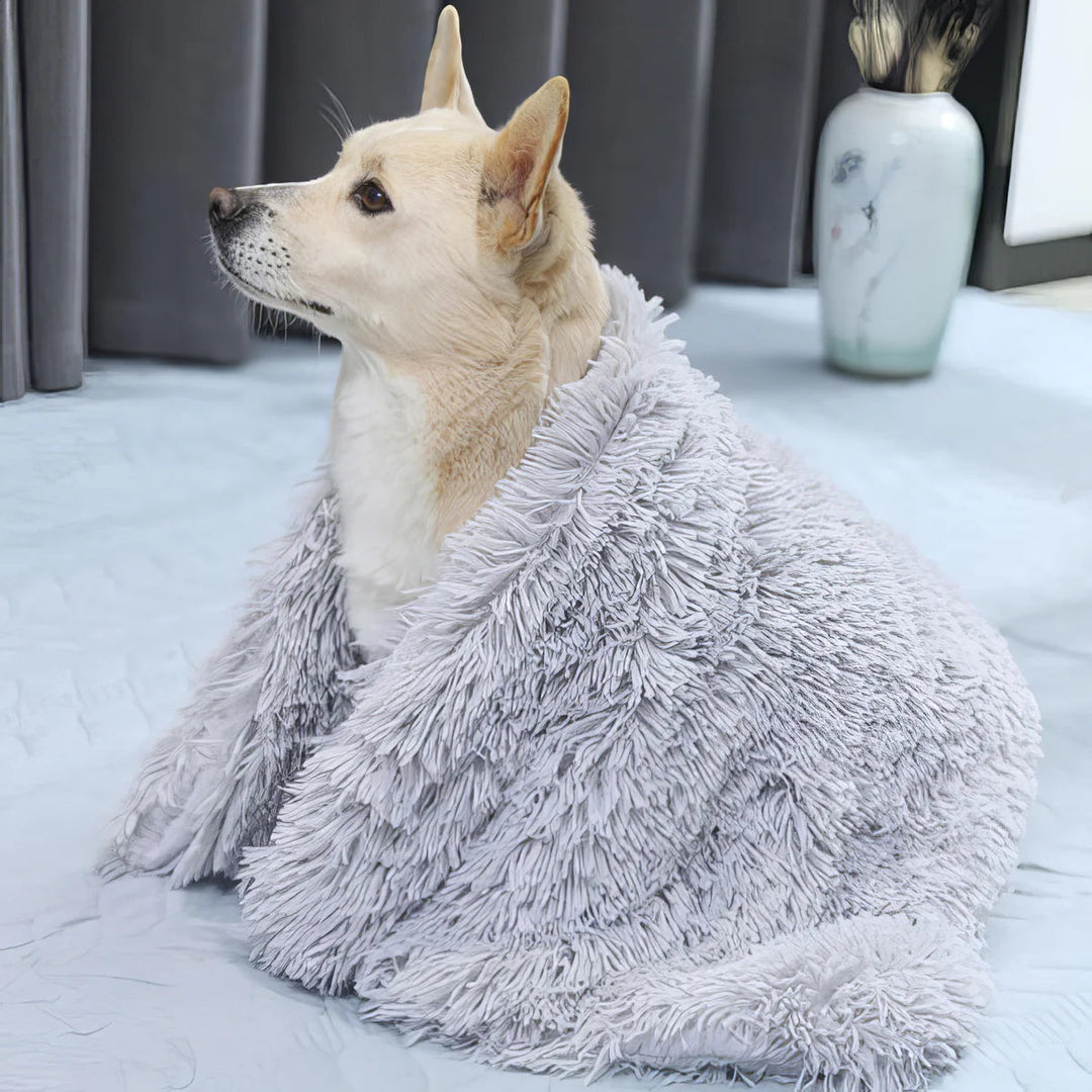 Warm, cozy pet blanket made of fluffy fleece, ideal for pet comfort and couch protection, available in neutral tones.