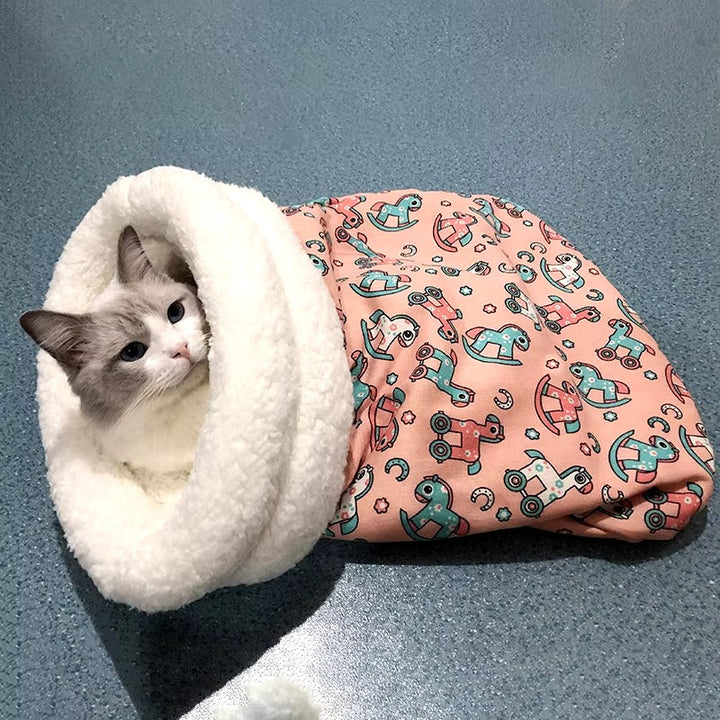 Plush pet sleeping bag and cat tunnel in a modern design, providing a secure and cozy pet retreat.