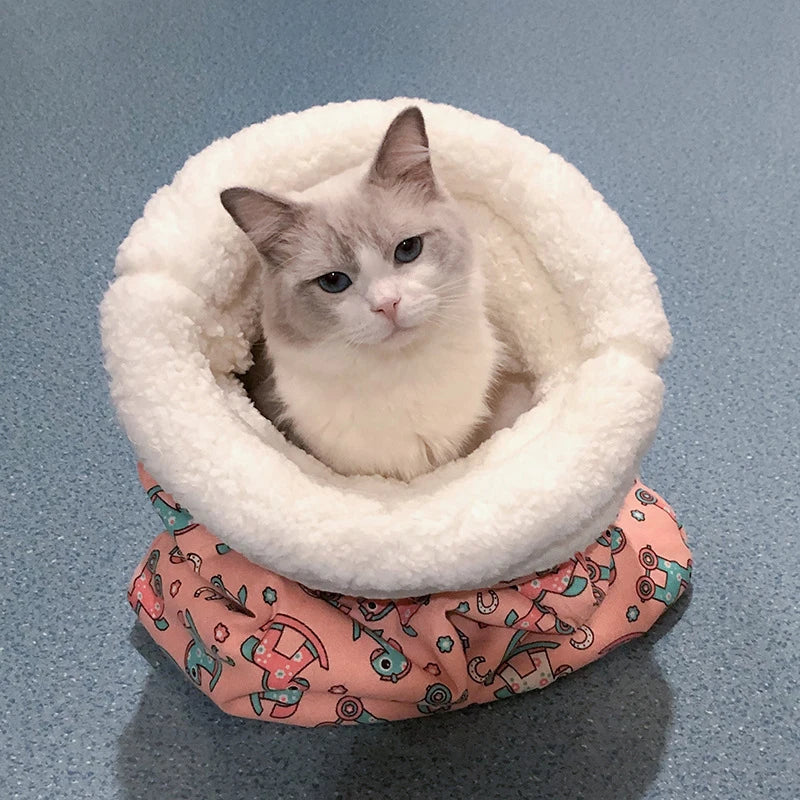 Multifunctional pet accessory: a cat sleeping bag and play tunnel, promoting rest and activity.