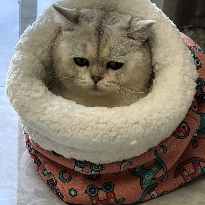 Gray cat sleeping bag with an integrated play tunnel, offering a private and stimulating environment.