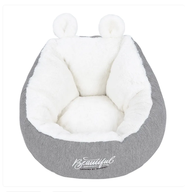 Small dog and cat bed featuring an adorable ear design, providing a cozy pet retreat.