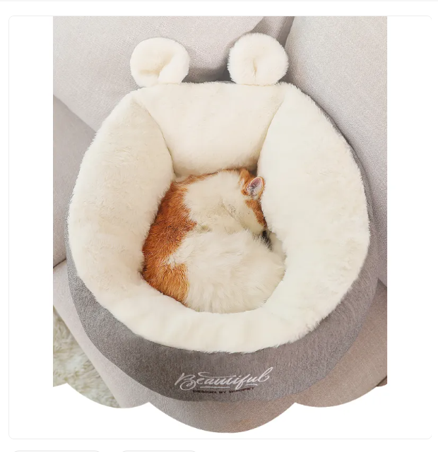 Comfortable pet bed with distinctive ear accents, ideal for both cats and small dogs.