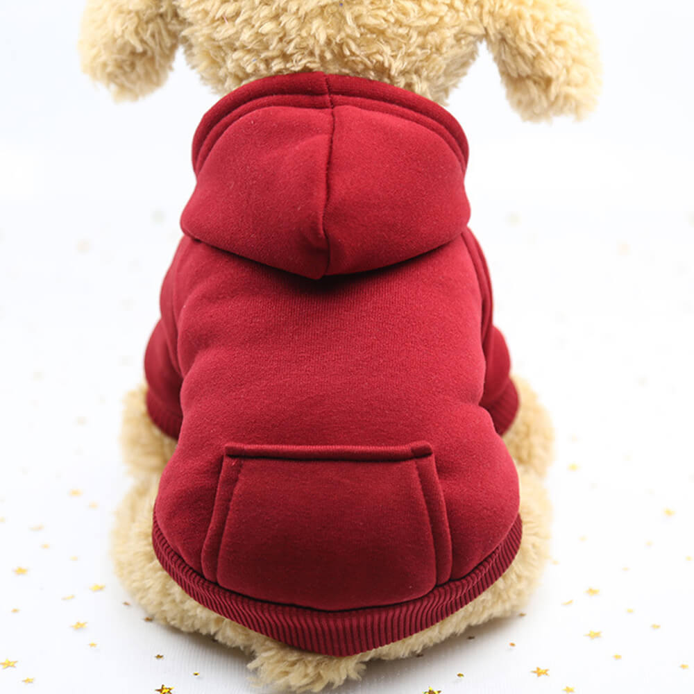 Dog looking playful in a fleece-lined pet hoodie sweatshirt with pocket, practical and chic.