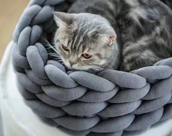 Handwoven cozy knitted cat bed in a neutral tone, providing ultimate pet comfort for small cats.