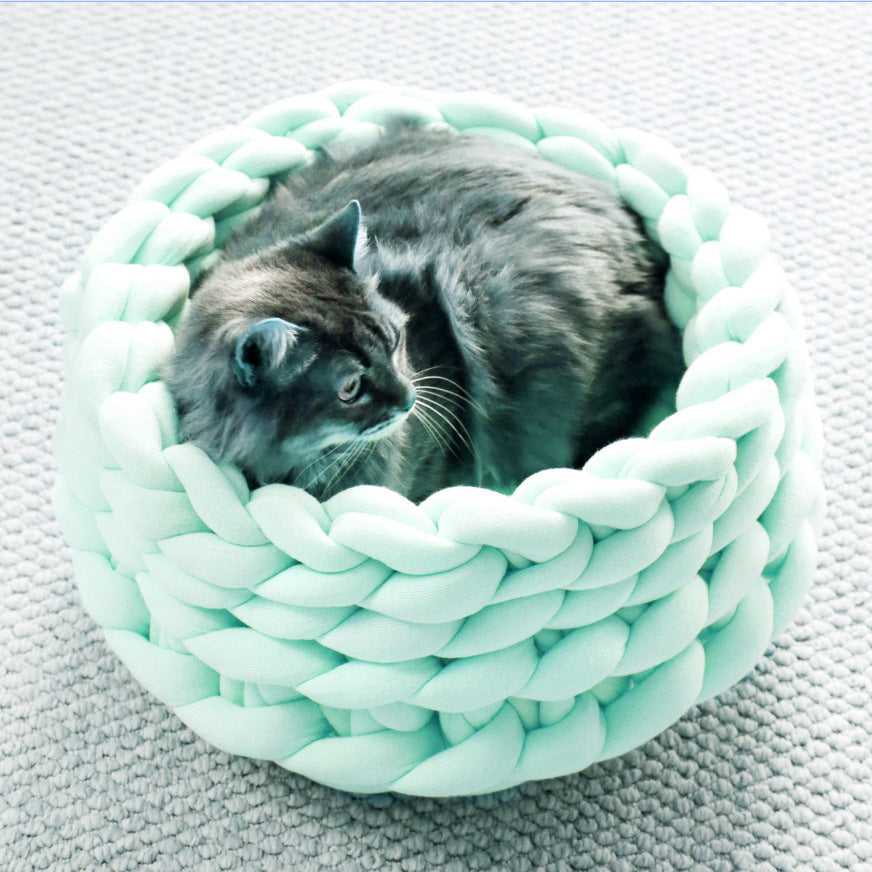 Luxurious knitted cat bed, a cozy pet accessory designed for deep sleep and feline relaxation.