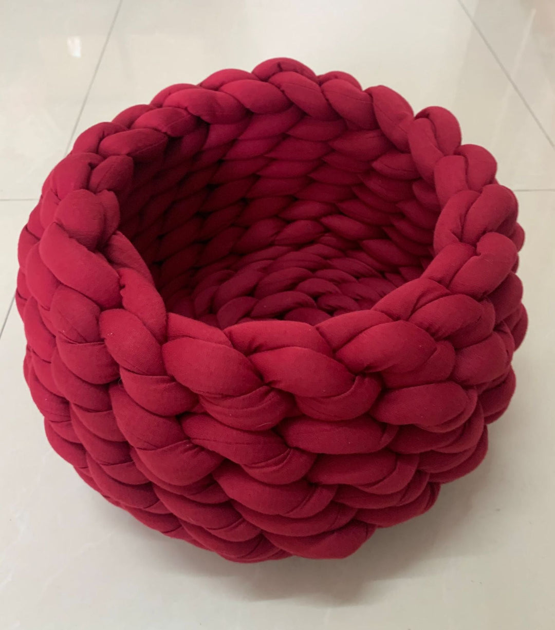 Comfortable knitted cat bed, a snug haven for cats, promoting relaxation and secure sleep.