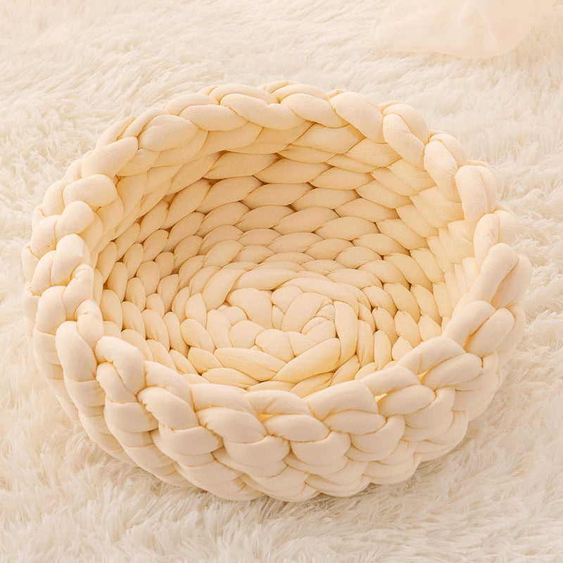 Premium hand-knitted cat bed, an essential pet accessory providing warmth and a comfortable retreat.