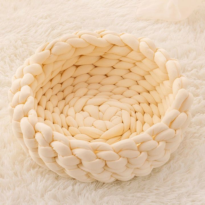 Premium hand-knitted cat bed, an essential pet accessory providing warmth and a comfortable retreat.