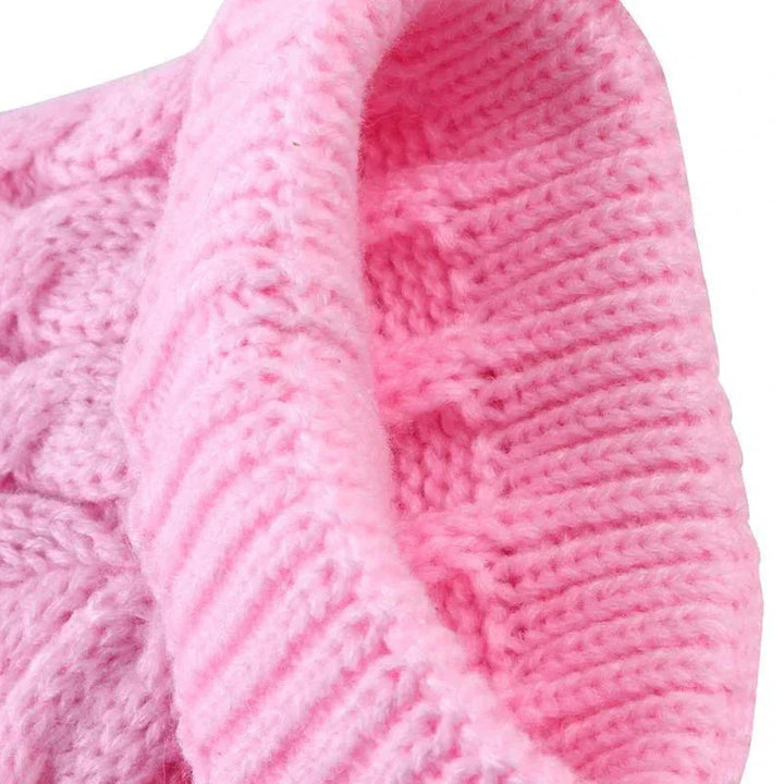 Black knitted high-neck dog sweater, providing comfort and warmth for small pets during colder months.