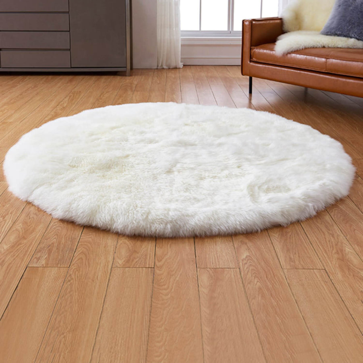 Soft white faux fur area rug with a long pile texture, ideal for adding warmth to any room