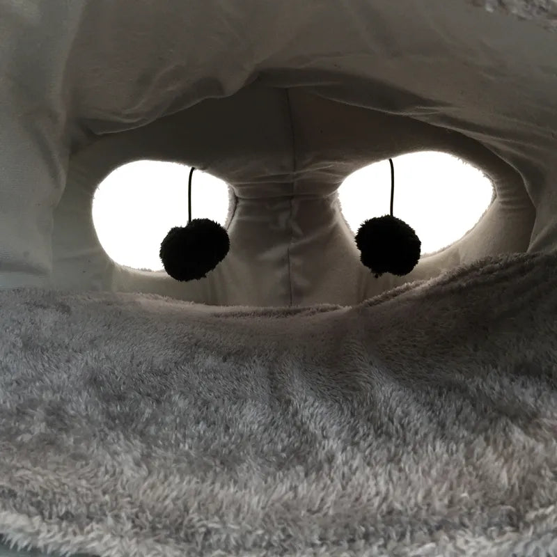 Soft cat sleeping cave with a fun mouse design, perfect for a cozy pet bed
