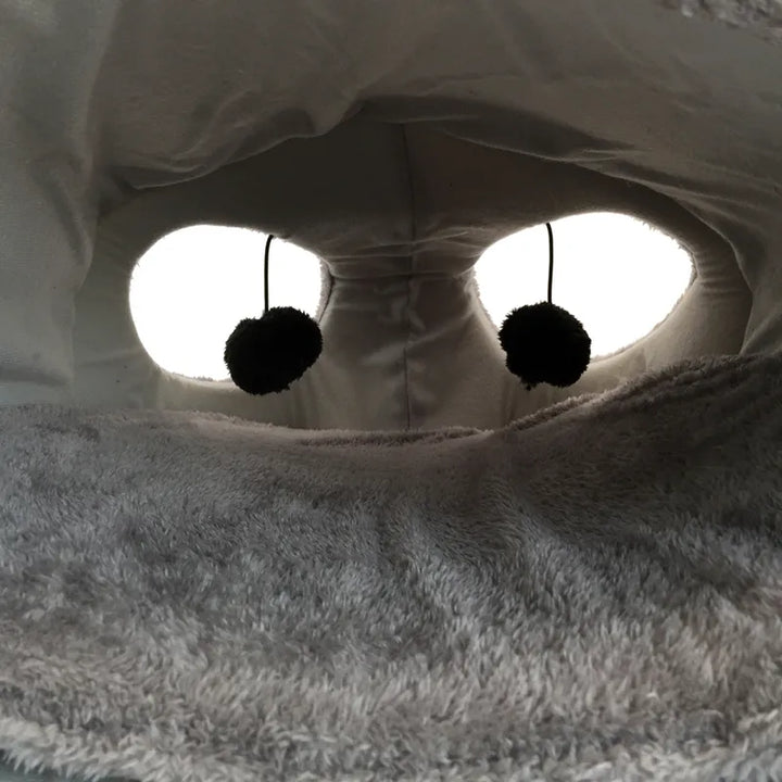 Soft cat sleeping cave with a fun mouse design, perfect for a cozy pet bed