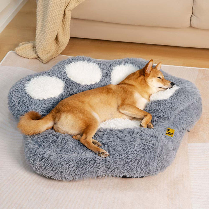 Cozy non-slip fluffy dog bed with paw print design, washable, for small pets, anxiety relief.