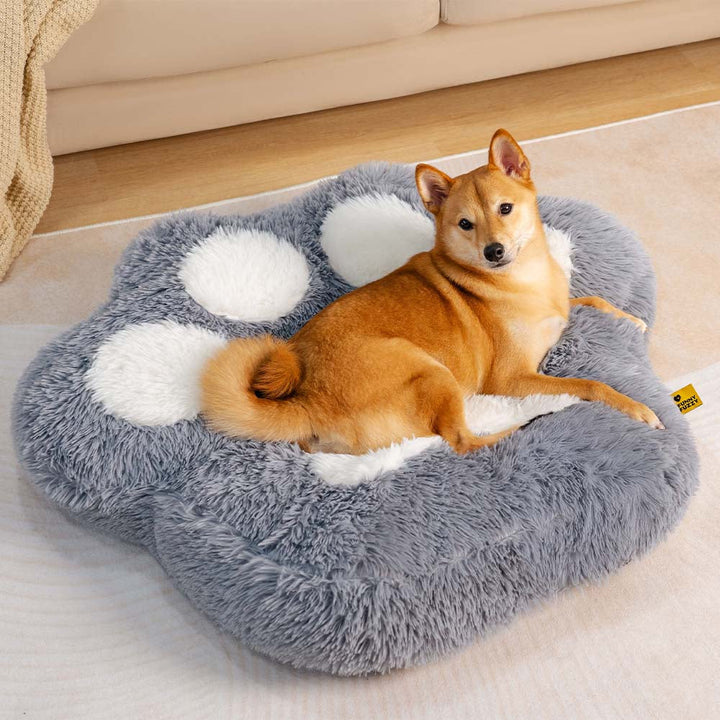 Fluffy pet bed with a paw spot design, washable for hygiene, providing cozy anxiety relief to dogs.