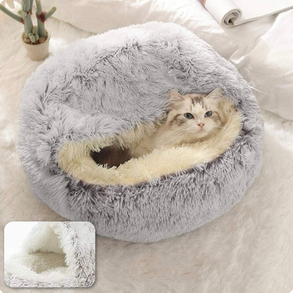 Calming orthopedic pet bed for cats, anti-slip base and cozy cave design for small pets.
