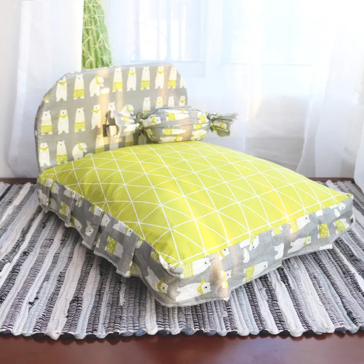 Stylish cat bed with an integrated backrest, ideal for small animals seeking a cozy retreat