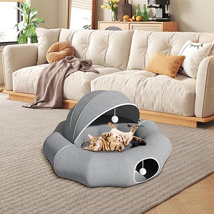 Cozy pet bed with removable roof and hanging play toy, perfect for cats or small dogs.