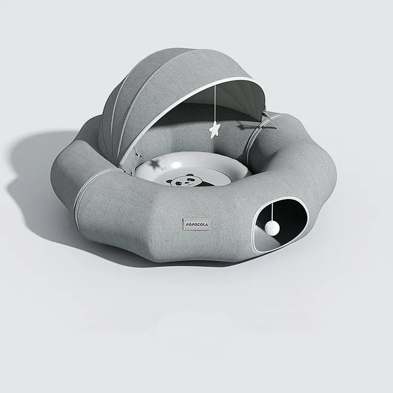 Soft, enclosed cat bed with a snug removable roof and a dangling toy for small pets.