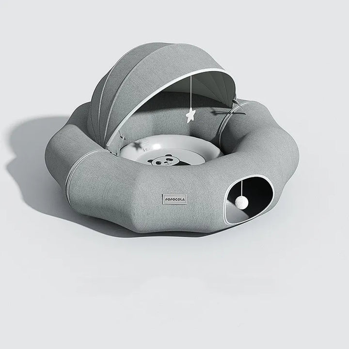 Soft, enclosed cat bed with a snug removable roof and a dangling toy for small pets.