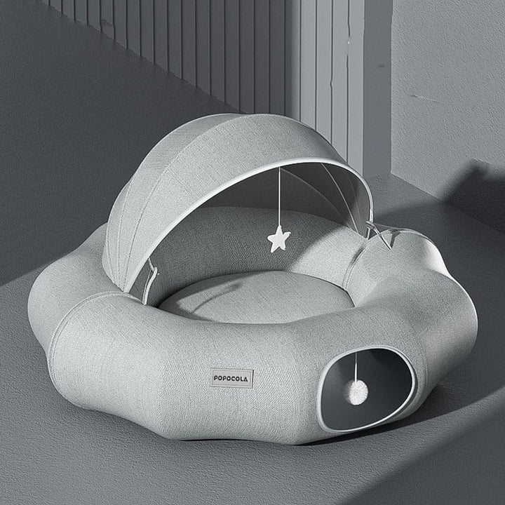 Comfortable pet house for cats & small dogs featuring a removable top and builtin play toy.